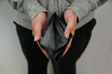 a man holding empty wallet