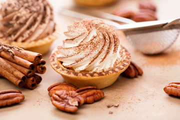 Sweet tartlets with cream, homemade. Food background.