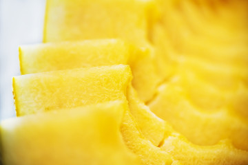 Sliced pieces of melon texture yellow background. Close up