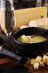 Gourmet Swiss fondue dinner on a winter evening with assorted ch