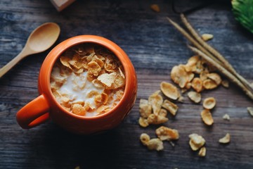 Top view of Coffee cup and paper notebook on wooden table background,copy space in concept color of autumn.
