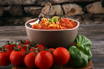 Tomato soup with meatballs in a bowl. Italian minestrone soup