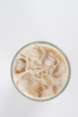 Ice tea with milk over white background