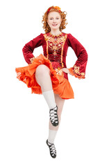 Beautiful woman in red dress for Irish dance jumping isolated