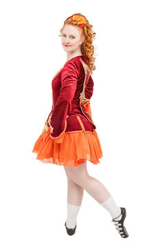 Beautiful woman in red dress for Irish dance isolated