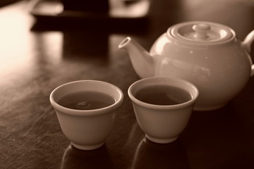 Sepia image of tea glass,tableware in the morning.