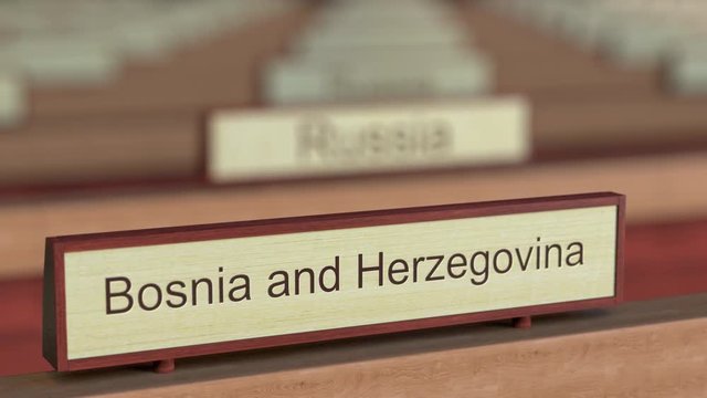 Bosnia and Herzegovina name sign among different countries plaques at international organization. 3D rendering