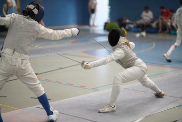 Girls fencing Foil at a tournament