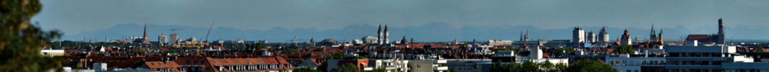 Huge natural panorama of Munich skyline with Alps in the background