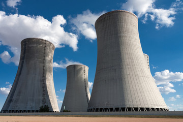 Nuclear power station, cooling towers against blue sky