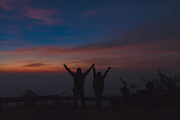 silhouette lover let go travel on the road with motorcycle, nice motorcycle with lover happy