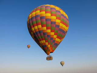 Hot air balloons against a clear blue sky