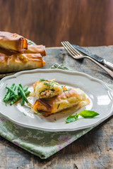 Salmon and basil butter filo parcels