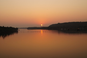 Fototapeta na wymiar Sunset on the Chapora river, Goa, India