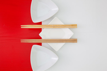 Ceramic bowls and bamboo chopsticks for sushi food