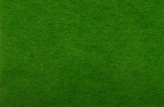 Green felt as background or texture.