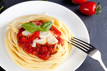 Spaghetti with tomato sauce and parmesan