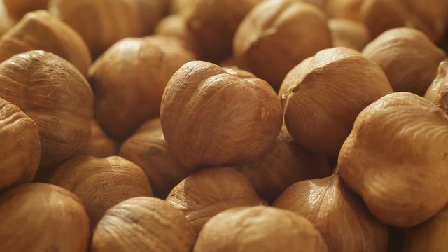 Macro shot of advancing hazelnut kernels, conquering the stand space