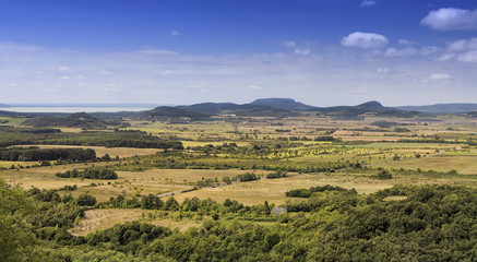 Fototapeta na wymiar The Balaton Highlands (Hungarian: Balaton felvidek) and the Mount Badacsony viewed from the 'Hegyestu' hill in Hungary