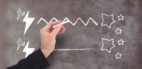 Composite image of hand holding a chalk and writing something