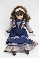 Ceramic porcelain handmade doll with long brown hair and blue dress