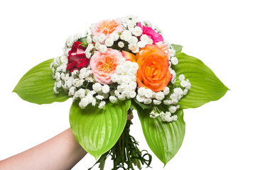 A bride's bouquet of beautiful roses and yarrow with hosta leaf in the girl hand. Flowers. Spring. Flat lay, top view. Love. Valentine's Day. Easter. Wedding card. Object