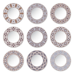 Set of nine decorative plates with a circular colored pattern, top view. White background. Vector illustration.