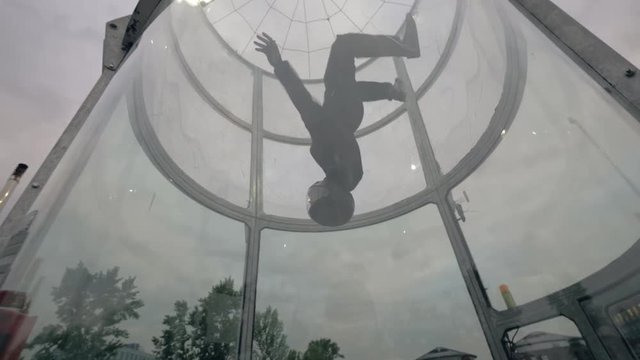 Flight skydiver in training wind tunnel. Flying in a wind tunnel. Indoor sky diving