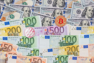 Litecoin and bitcoin with dollar and euro bills. business concept