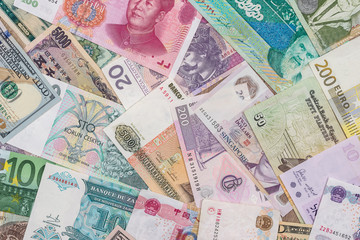 Fototapeta na wymiar many different currency banknotes from world country as background
