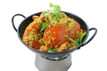 Stir-fried Great Mud-Crab (Mangrove-Crab or Black-Crab) with Yellow Curry Powder on Black Pan on the Mini Oven, Isolated on White Background, High Angle Top View, Closeup Selective Focus at Food.