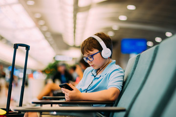 Young boy waiting for flight