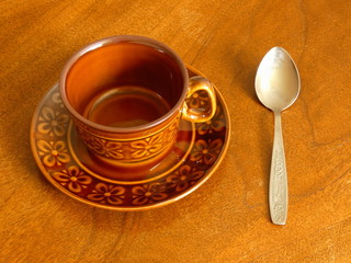 Coffee Cup and Spoon On Wooden Table