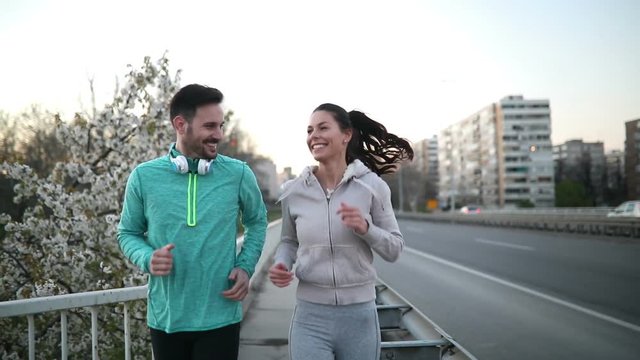 Beautiful couple jogging and fitness training outdoor