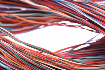 Colored cables on white background closeup