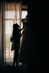 Bride silhouette with long brunette hair.