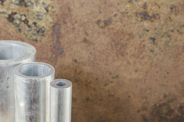 Metal pipelines profile on rusty background