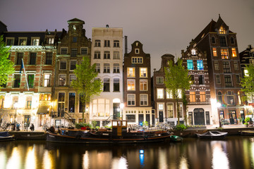 Obraz premium Canals of Amsterdam at night. Amsterdam is the capital of the Netherlands