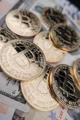 Fototapeta na wymiar coins of bitcoin on dollar notes