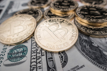 coins of bitcoin on dollar notes