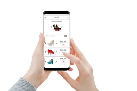 Isolated female hands shopping shoes online on smartphone