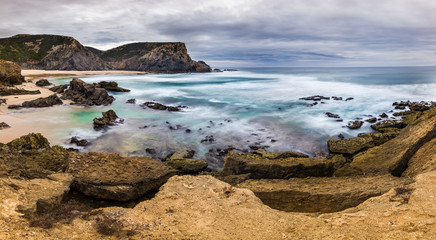 Fototapeta na wymiar Typical Portugal - rough yet beautiful coast, amazing turquoise water. Beautiful, amazing, breathtaking.