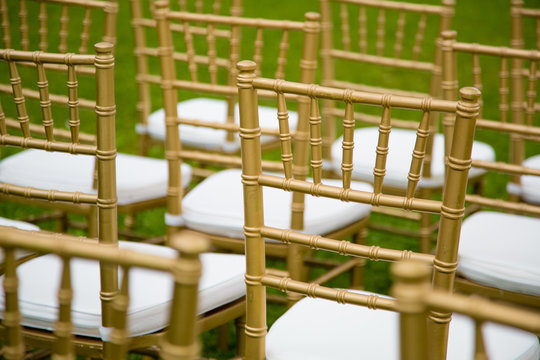 gold and whiteChairs for wedding ceremony