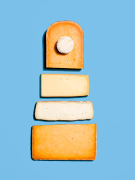 literal cheese cake, on blue background, studio