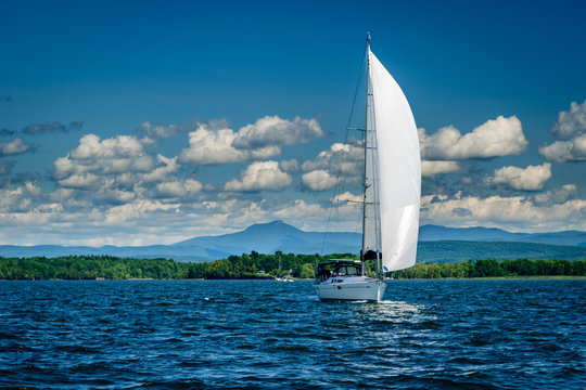 Sailboat on Lake Champlain in front of Camel's Hump mountain