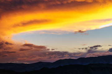 Scenic sunset and sunrise in mountainous region of Altai