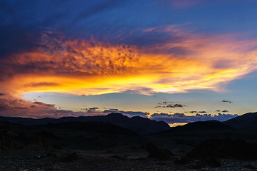Scenic sunset and sunrise in mountainous region of Altai