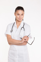 Fototapeta premium Portrait of a beautiful young woman doctor with stethoscope.