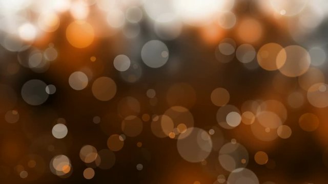 Orange and black defocused blur bokeh light background – seamless looping, 4K, abstract Halloween background