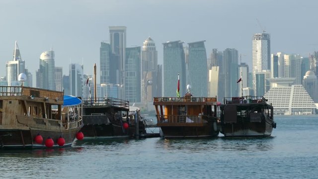 Traditional Dhow, Arab sailing vessels in the Dhow Harbour with the Doha skyline in the background